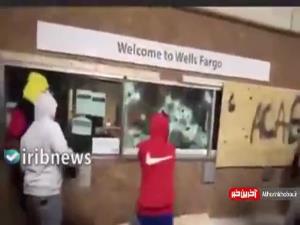 تصاویری از حمله غارتگران آمریکایی به یک بانک