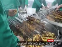 پخت و توزیع غذا توسط خادمان آستان قدس رضوی برای زلزله‌زدگان سوری