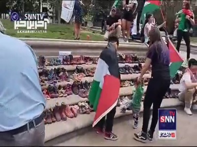 نمایش صدها کفش بچه گانه آغشته به رنگ قرمز مقابل کاخ ریاست‌جمهوری شیلی