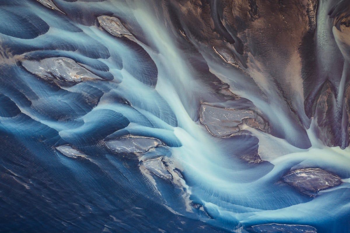 عکس/تصاویر هوایی از زیبایی انتزاعی رودخانه‌های یخ‌زده ایسلند 
