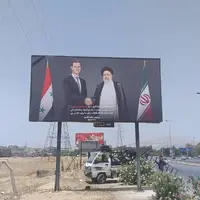 تصاویر رئیس‌جمهور شهید ایران و رئیس‌جمهور سوریه در خیابان‌های دمشق 