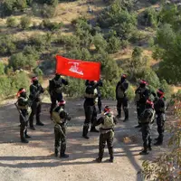عکس/ حزب الله پرچم قرمز را به نشانه انتقام برافراشت