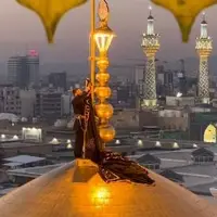 تعویض پرچم گنبد مطهر حرم امام رضا(علیه‌السلام)