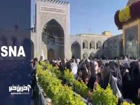 آیین تعویض پرچم گنبد حرم مطهر رضوی