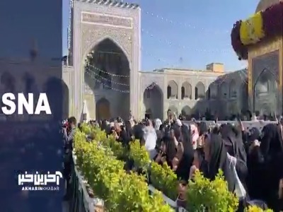 آیین تعویض پرچم گنبد حرم مطهر رضوی