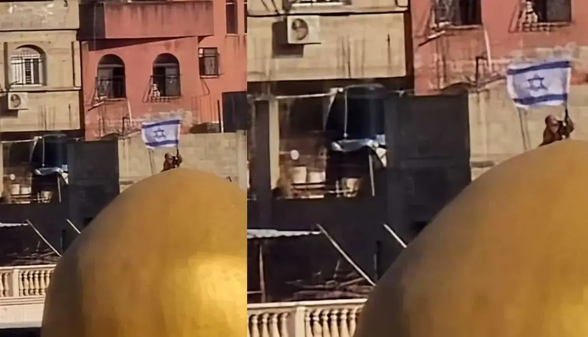 اهتزاز پرچم اسرائیل بر روی گنبد مسجد ابوبکر در کرانه باختری
