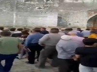 نصب تصویر شهید رئیسی در حرم مطهر رضوی
