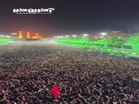 لحظه تعویض پرچم بارگاه حضرت سیدالشهدا (ع)