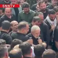 تلقین خواندن حاج منصور ارضی بر پیکر شهید حاجی زاده