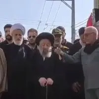 اقامه نماز بر پیکر سردار شهید غلامعلی رشید و فرزندش در دزفول