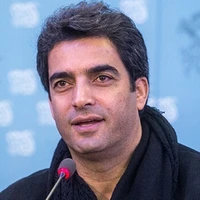 قابی از منوچهر هادی و کشتی‌گیر مشهور در تعزیه