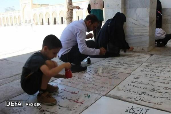 برگزاری پویش رنگ‌آمیزی سنگ مزار شهدا در آرامگاه خواجه‌ربیع مشهد