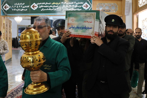 طواف پیکر شهید سیدرضایی بر گرد ضریح حضرت معصومه(س)