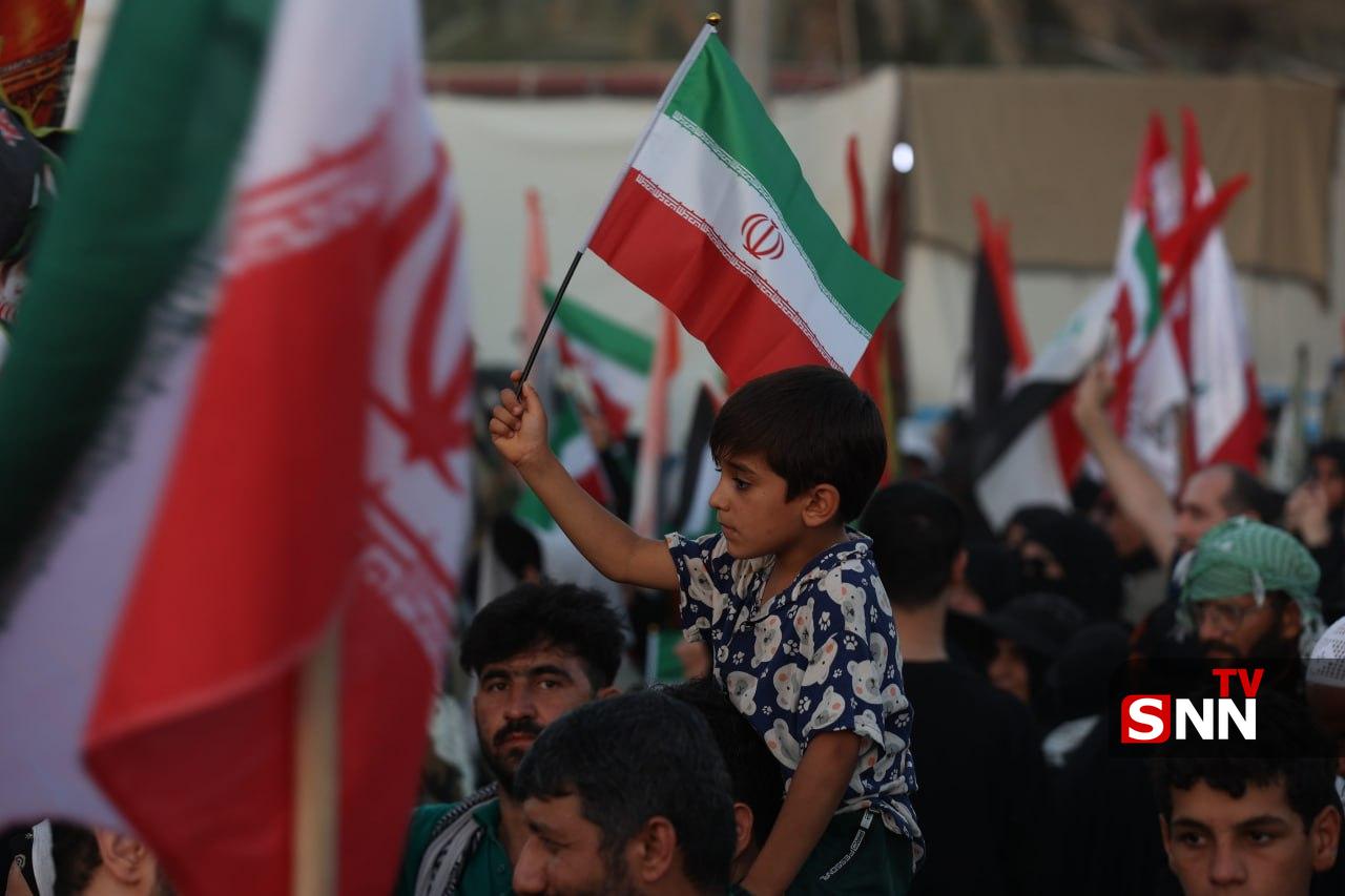 اهتزار پرچم کشورهای حامی مقاومت در راهپیمایی عظیم اربعین