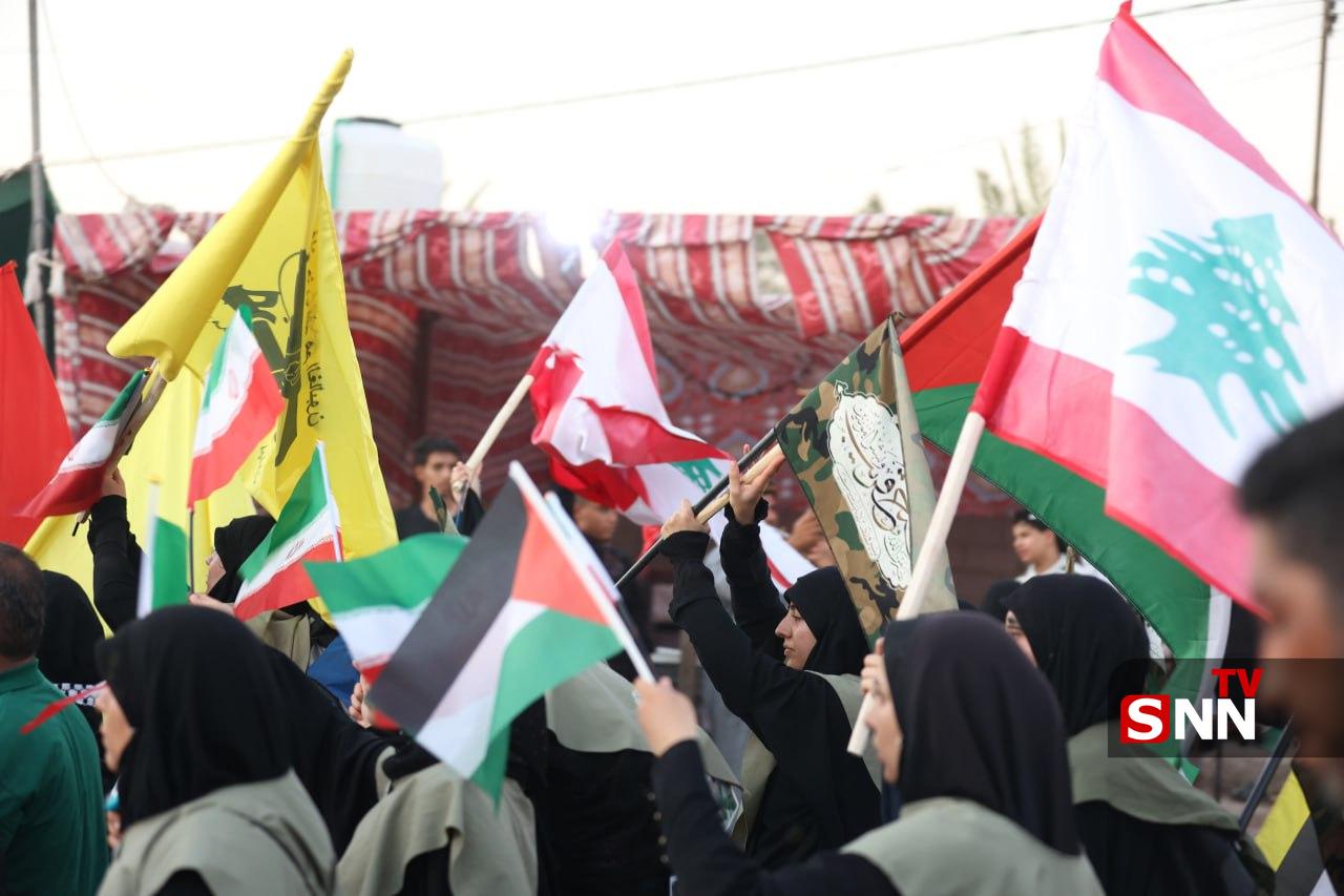 اهتزار پرچم کشورهای حامی مقاومت در راهپیمایی عظیم اربعین