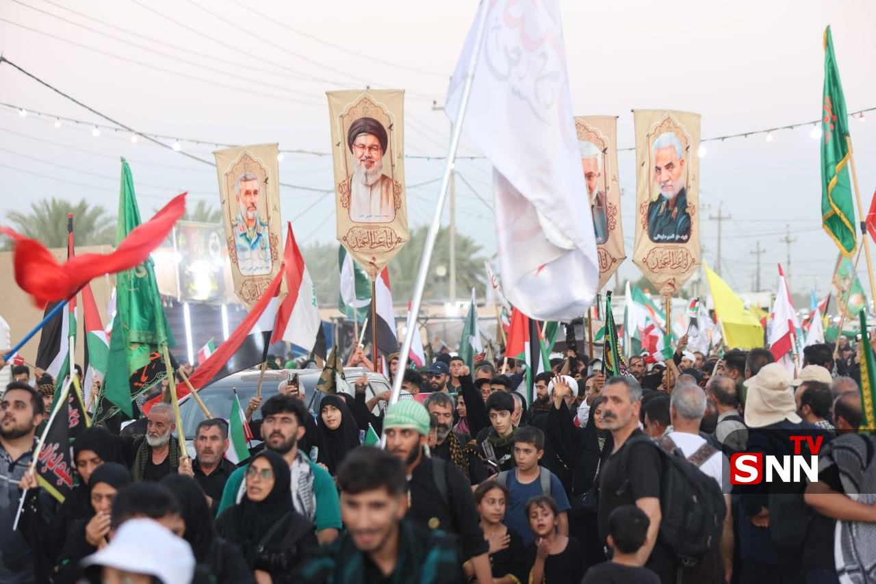 اهتزار پرچم کشورهای حامی مقاومت در راهپیمایی عظیم اربعین