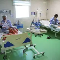 وزیر بهداشت: افراد فاقد بیمه درمانی روی تخت بیمارستان بیمه می‌شوند