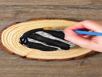 نقاشی ماه و خورشید روی تنه درخت