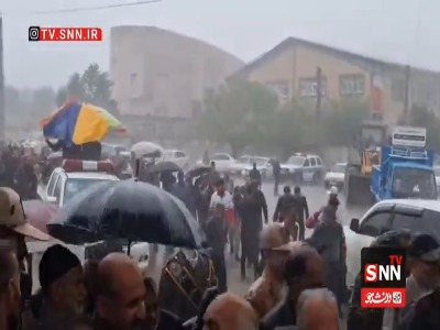 تشییع پیکر شهید وحید عنایت زیر بارش شدید باران کلاله